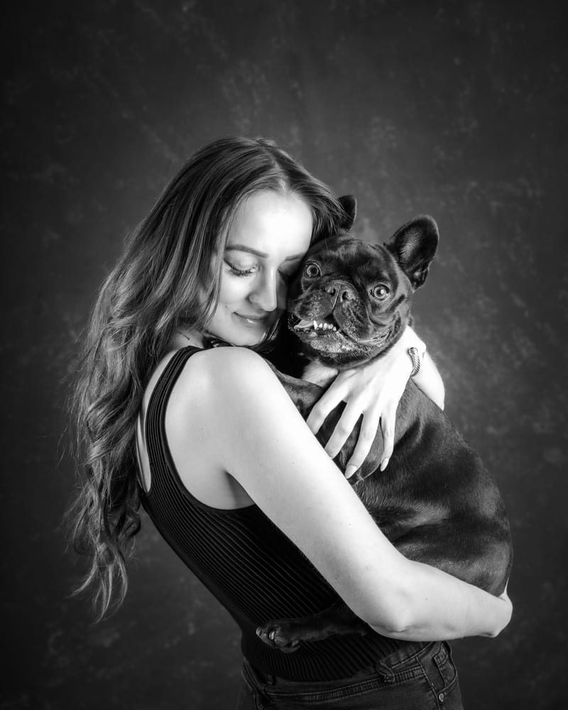 Victoria cheek to cheek with her French bulldog